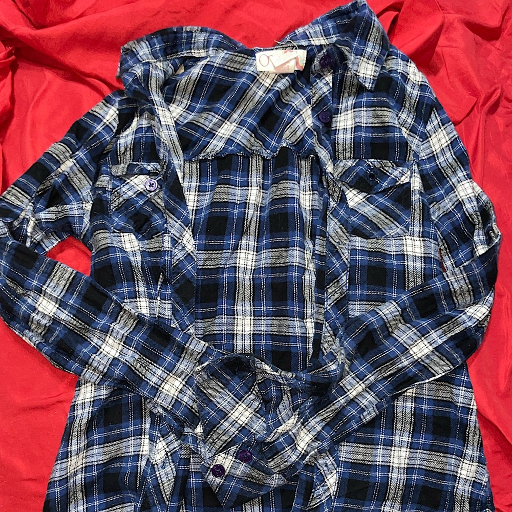 This is an OP plaid long sleeved shirt that is a button down in the front